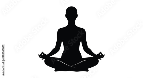 Silhouette of a woman in lotus yoga pose meditating peacefully