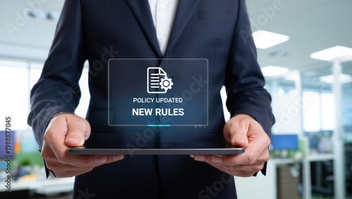 Business professional holding tablet with policy updated notification, Corporate compliance, new rules implementation, governance management, regulatory change, and digital documentation process.