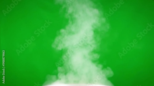 Rising steam on green screen with white surface in bright colorful lighting for visual effects