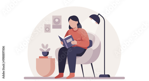 Woman engrossed in reading a book while comfortably seated.