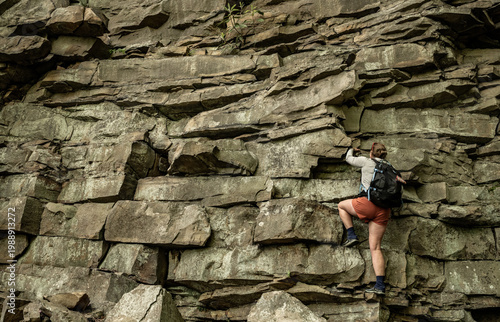 Konstfotografi Woman Starts to Climb up Terraced Rocks in New River Gorge