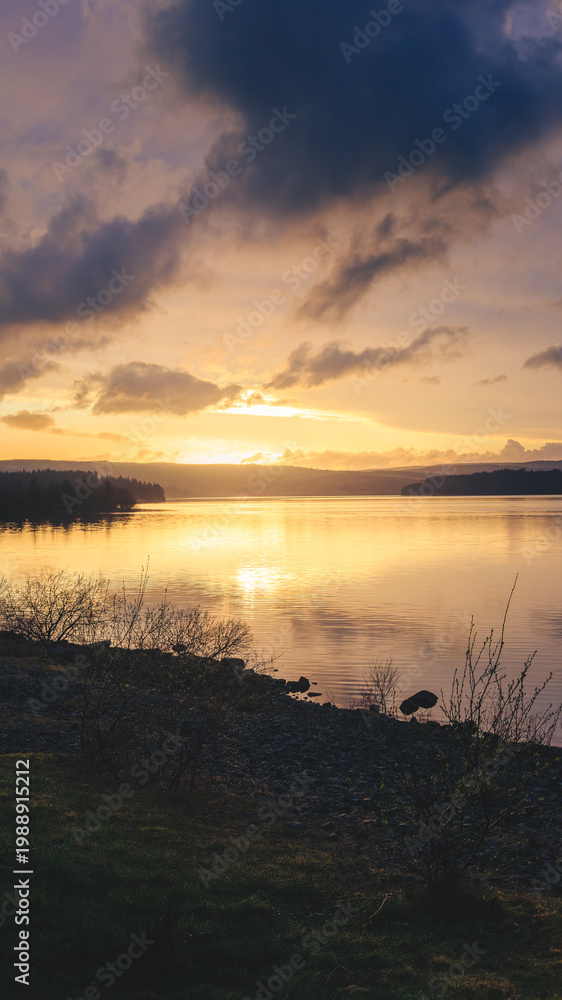Obraz premium Dramatic Sunset over Kielder Reservoir, Kielder, Northumberland April 2026. 