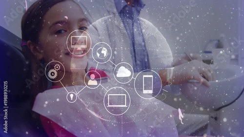 Dentist adjusting, child reclining smiling, network growing linking devices, showing dental data