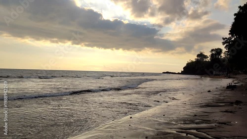 The calm waves along the coastline