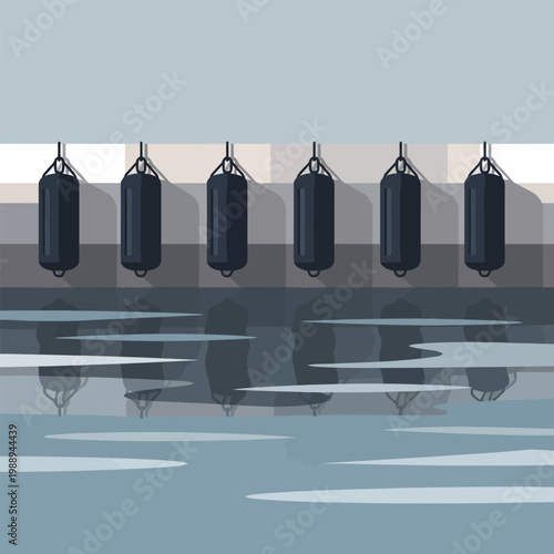 Row of punching bags hanging above water at a training facility