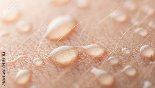 Close-up view of moist human skin with water droplets and fine hairs.