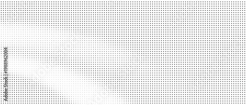 Halftone dots pattern with gradient effect on white background

