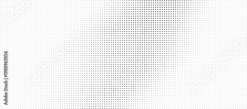 Halftone pattern with varying dot density on white background for design
