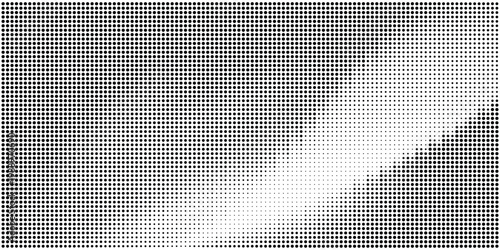 Halftone dots pattern with gradient effect on white background
