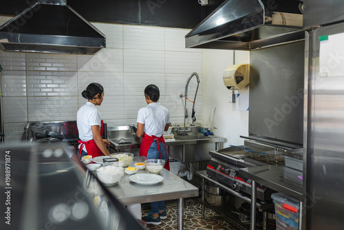 Cooks preparing ingredients for baking bread in the kitchen