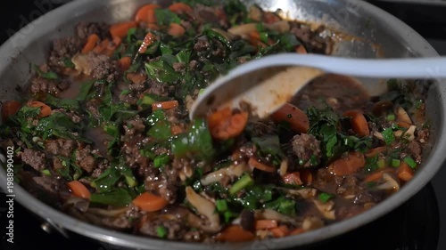 Cooking of Simple Dinner with Ground Bison, Mushrooms, Carrots and Italian Dandelion Greens
