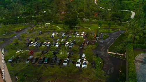 Bilde på lerret The top view of the photo shows a car park with many trees in the area, it looks beautiful and neat