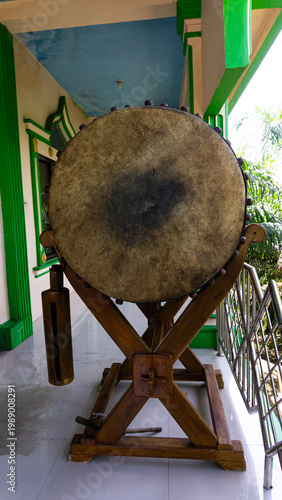 A bedug (beduk) is a musical instrument used for religious communication. In Indonesia, the bedug is typically used to signal the arrival of prayer times. It is typically made from cow or buffalo hide