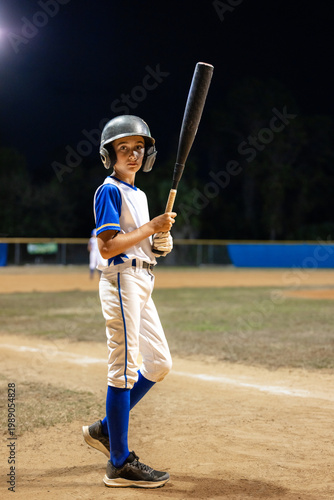 Young Baseball batter looking at camera