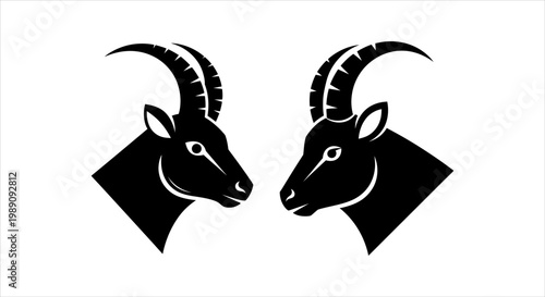 Two Black Ibex Heads Facing Each Other Silhouette Icon Design
