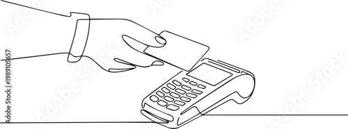 Hand holding a card near a payment terminal on a white surface