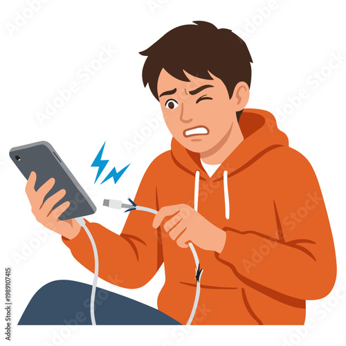 A frustrated man is struggling with a broken phone charger cable.