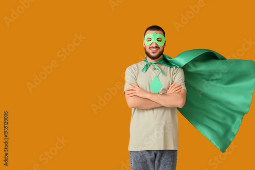Young man dressed as superh...