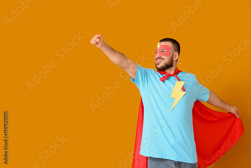 Young man dressed as superh...
