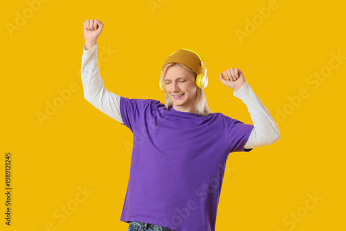 Young blonde man in hat wit...
