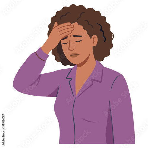 A stressed woman with curly brown hair touches her forehead in an indoor setting