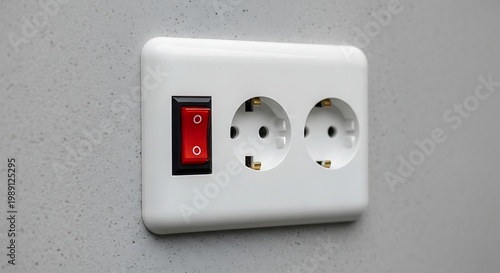 White Electrical Outlet with Red Switch on Gray Wall.
