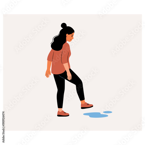 Woman stepping over puddle on sidewalk in city street scene outdoors