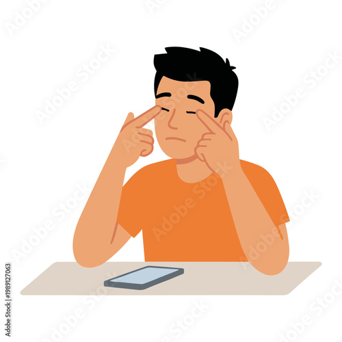 A man sits at a desk, rubbing his temples in frustration next to a phone.