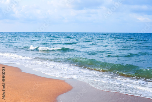 Fotografi Stunning tropical beach landscape with crystal clear turquoise water and golden sand under a bright blue sky