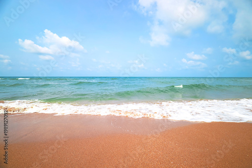 Fotografi Stunning tropical beach landscape with crystal clear turquoise water and golden sand under a bright blue sky