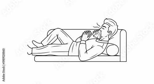Man lying on couch, blowing nose with tissue, feeling unwell