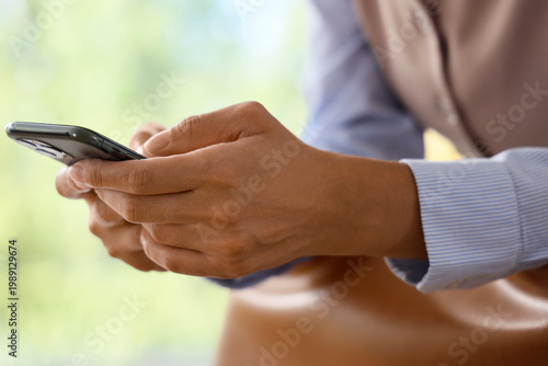 Young businesswoman using m...