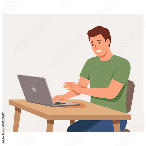 Man sitting at desk working on laptop with frustrated expression
