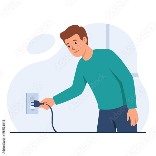 A man is plugging a cable into an electrical outlet.