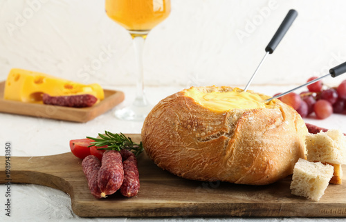 Cheese fondue in bread with...