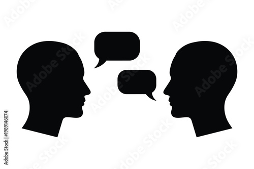 Communication concept two silhouetted heads with speech bubbles representing dialogue and interaction