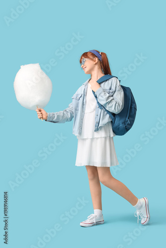 Teen girl with cotton candy...