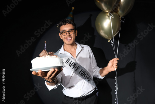 Happy young businessman wit...