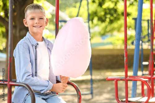 Teen boy with cotton candy ...