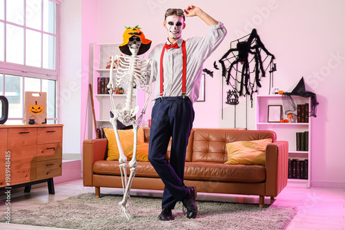 Young happy man dressed for...