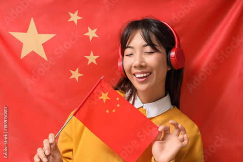 Young Asian woman in headph...