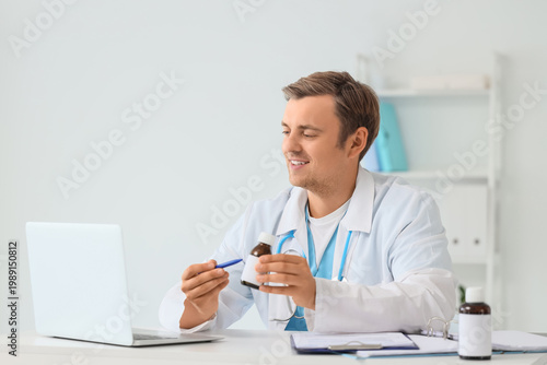 Male doctor with medicine a...