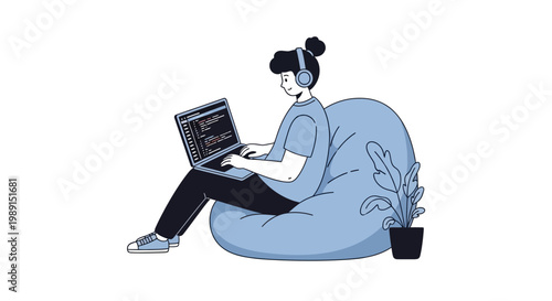 Young person coding on laptop while relaxing in beanbag chair with headphones