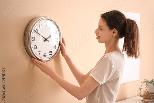 Young happy woman hanging c...