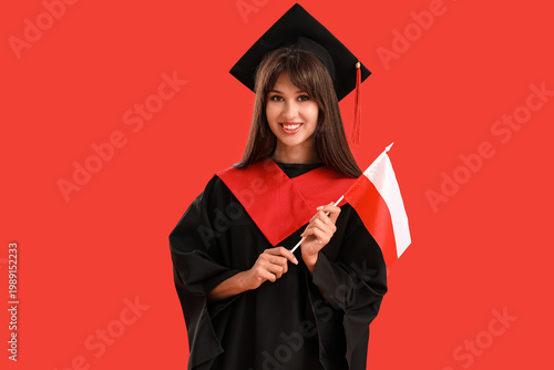 Female graduate with flag o...