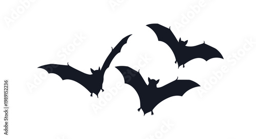 Three dark silhouettes of bats flying against a white background, perfect for Halloween themes or nocturnal wildlife graphics.