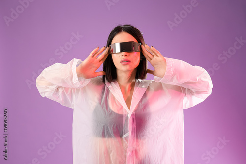 Young woman in VR glasses o...