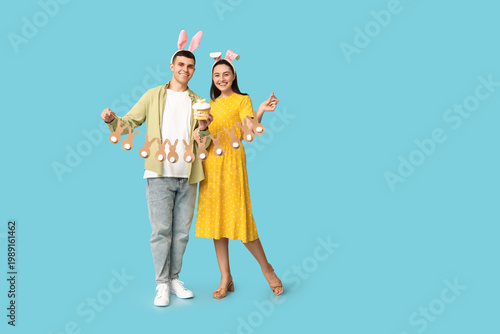 Happy young couple with Eas...