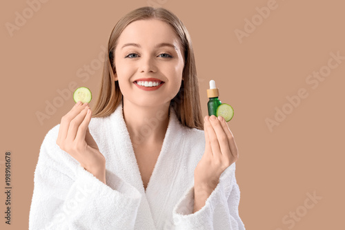 Young woman in bathrobe wit...