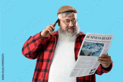 Mature man with newspaper t...